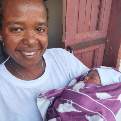 Midwife Atsede holding a baby